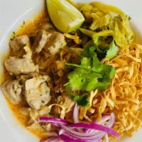 Khao Soi (Curry noodle) · A curry noodle dish from northern Thailand.  Coconut curry base with chicken, egg noodle, ci...