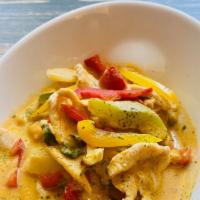 Yellow Curry · Potato, carrot, onion, and tomato in yellow coconut curry