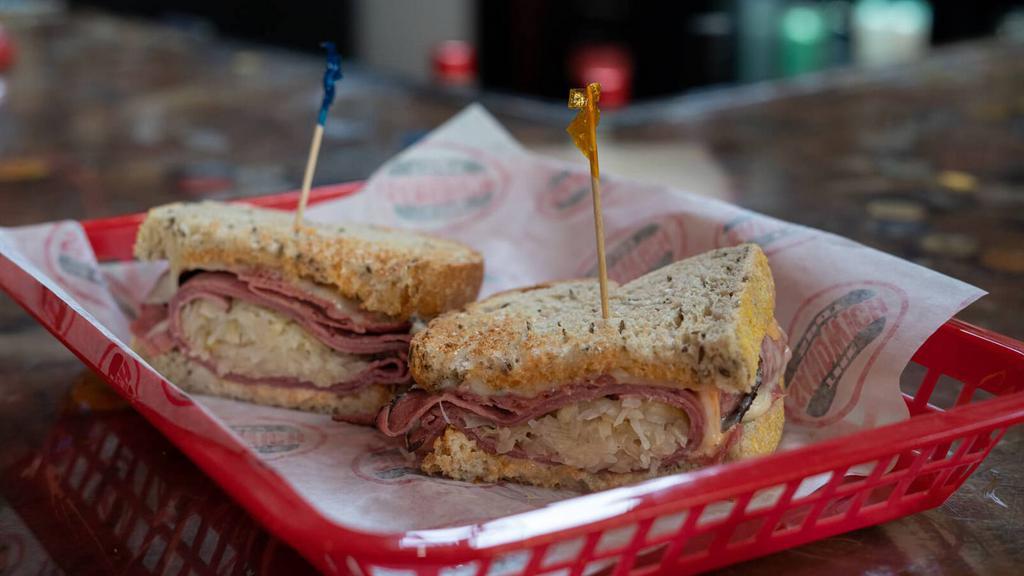 The Frequent Flyer · (Toasted) Pastrami, Sauerkraut, 1000 Island Dressing & Swiss Cheese