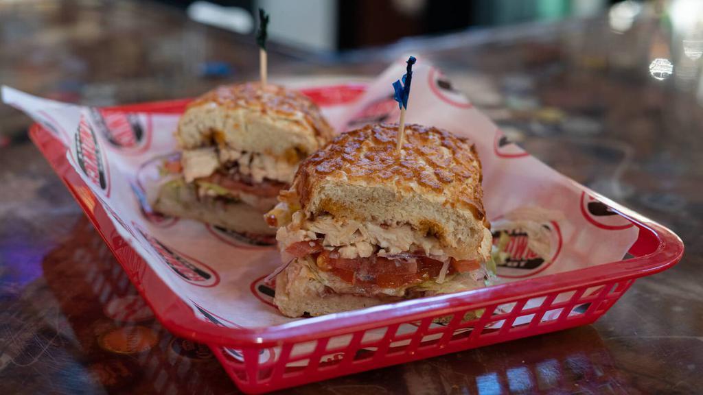 24. The Jail Bird · Marinated Chicken, Cranberry, Bomb Sauce, and Pepper Jack Cheese.
