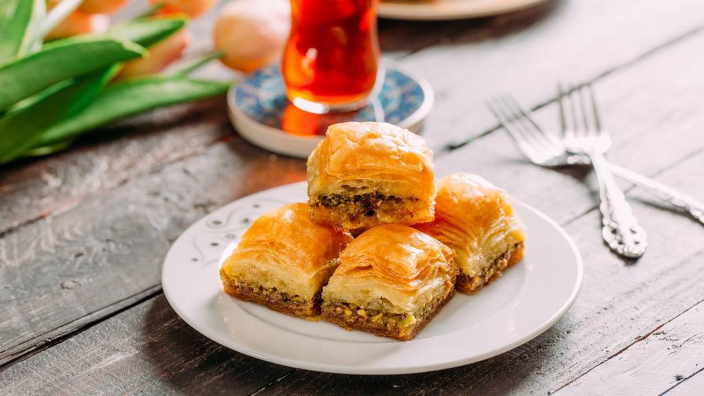 Baklava · Crispy wafers topped with nuts and honey syrup.