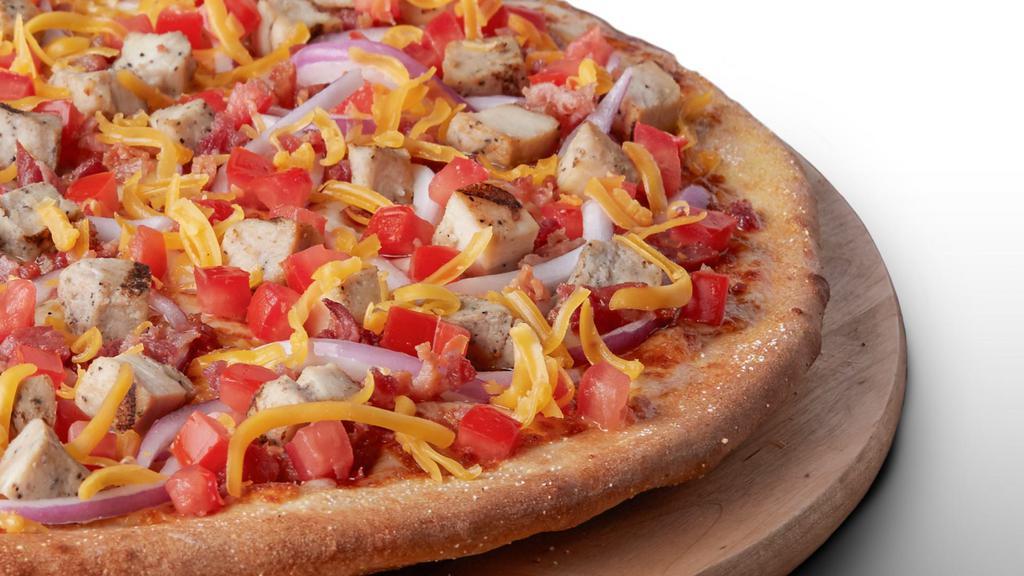 Bacon Chicken Supreme - Medium · Signature garlic white sauce on our original crust, topped with mozzarella and cheddar cheeses, all-natural grilled chicken, smoked bacon, fresh Roma tomatoes, and red onions.