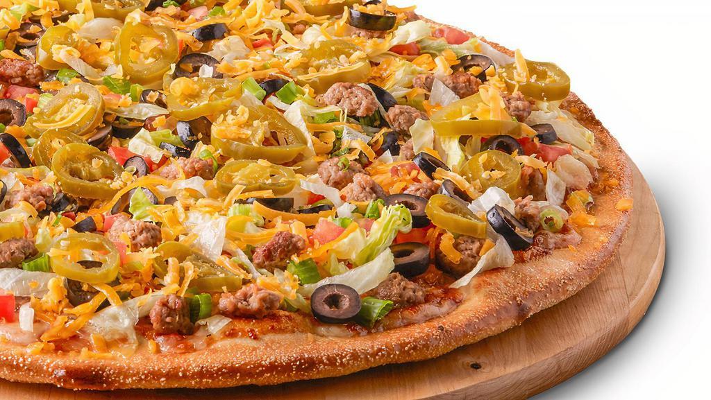 Beef Taco Pizza - Medium · Taco Sauce on our Original Crust, topped with Cheddar and Mozzarella Cheeses, Beef, Lettuce, Green Onions, Black Olives, and Fresh Roma Tomatoes. (Jalapeños optional.)