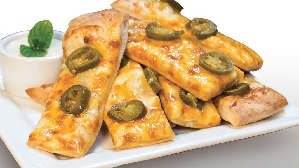 Cheezee Jalapeño Bread · Signature Creamy Garlic Sauce, topped with Mozzarella Cheese, Cheddar Cheese, and Jalapeños. Served with a side of Ranch Sauce.