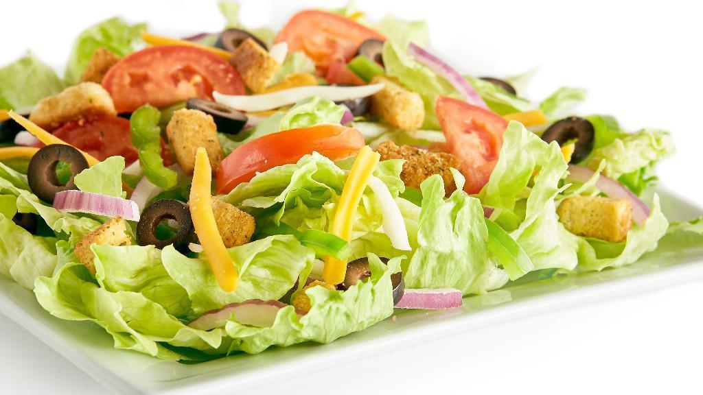 Garden Salad · Iceberg lettuce, bell peppers, red onions, black olives, fresh Roma tomatoes, mozzarella cheese, cheddar cheese, seasoned croutons, and your choice of dressing.