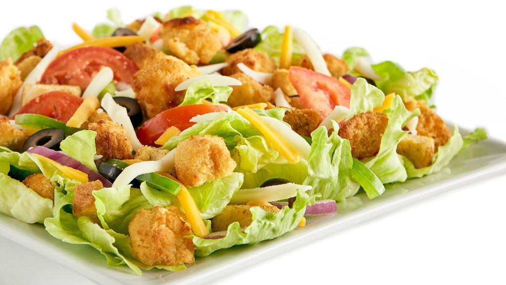 Crispy Chicken · Iceberg lettuce, crispy chicken tenders, red onions, fresh Roma tomatoes, cheddar cheese, mozzarella cheese, seasoned croutons, bell peppers, black olives, and your choice of dressing.