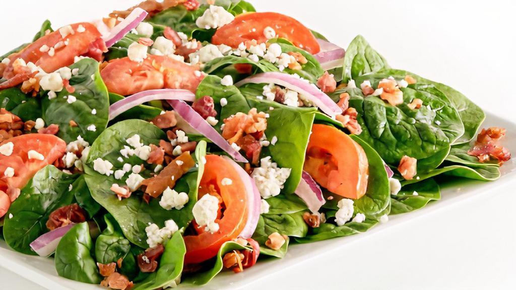 Spinach Tomato Salad · Fresh baby spinach, fresh sliced tomatoes, sliced red onions, applewood smoked wood bacon, crumbled Gorgonzola cheese.