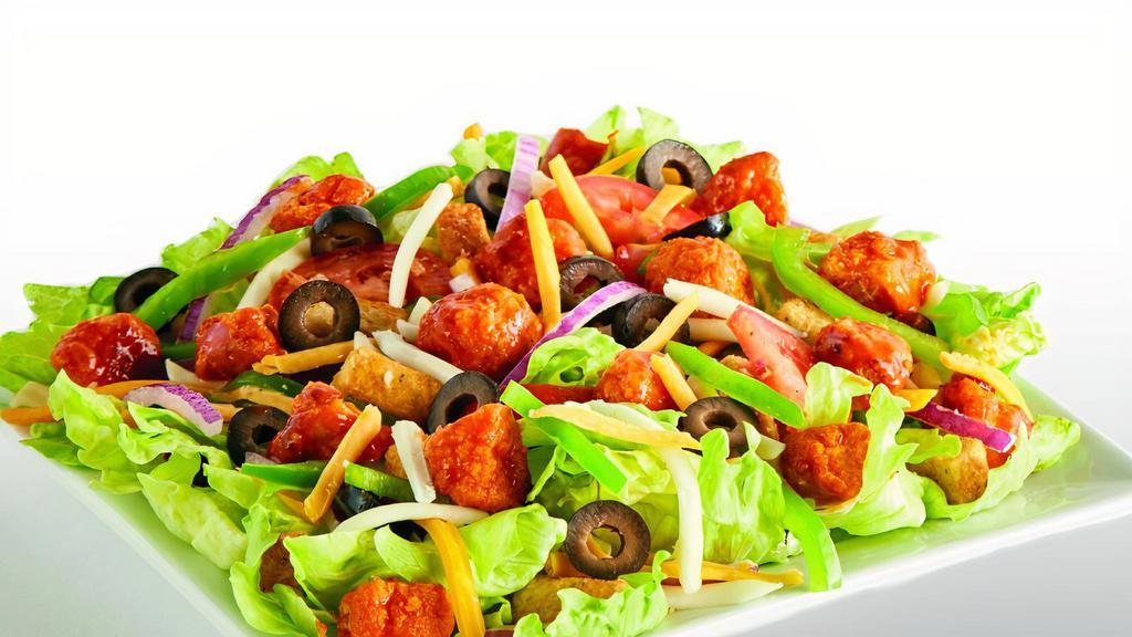 Buffalo chicken salad · Iceberg Lettuce, Buffalo Chicken, Bell Peppers, Red Onions, Black Olives, Fresh Roma Tomatoes, Mozzarella Cheese, Cheddar Cheese, Seasoned Croutons, and Ranch or your choice of dressing.