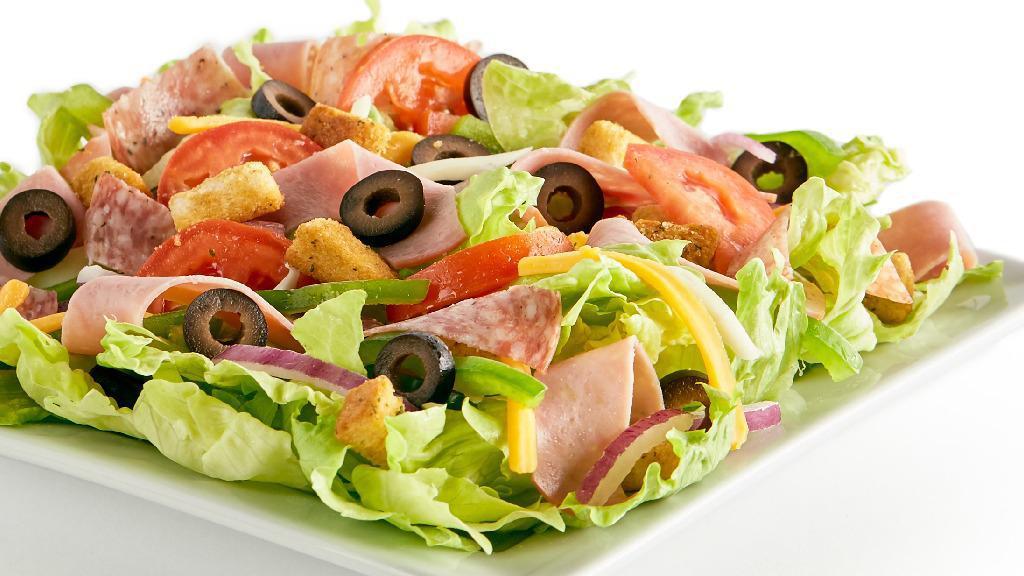 Antipasto · Iceberg lettuce, bell peppers, red onions, black olives, Canadian bacon, Italian dry salami, fresh Roma tomatoes, mozzarella cheese, cheddar cheese, seasoned croutons, and your choice of dressing.