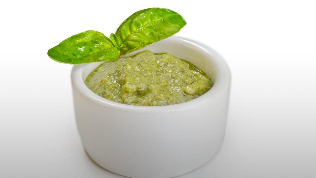 Side Creamy Pesto Sauce · Our signature blend of basil, pine nuts, garlic and olive oil mixed with our smooth creamy white garlic sauce.