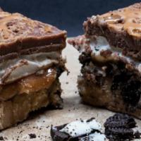 Peanut Butter Pie Fudge · 1/4 lb of Oreo cookie pie crust, peanut butter & chocolate fudge, caramel, and marshmallow.
