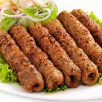 Chicken Seekh Kebab (2) · Freshly ground chicken mixed with onions, herbs, and spices.