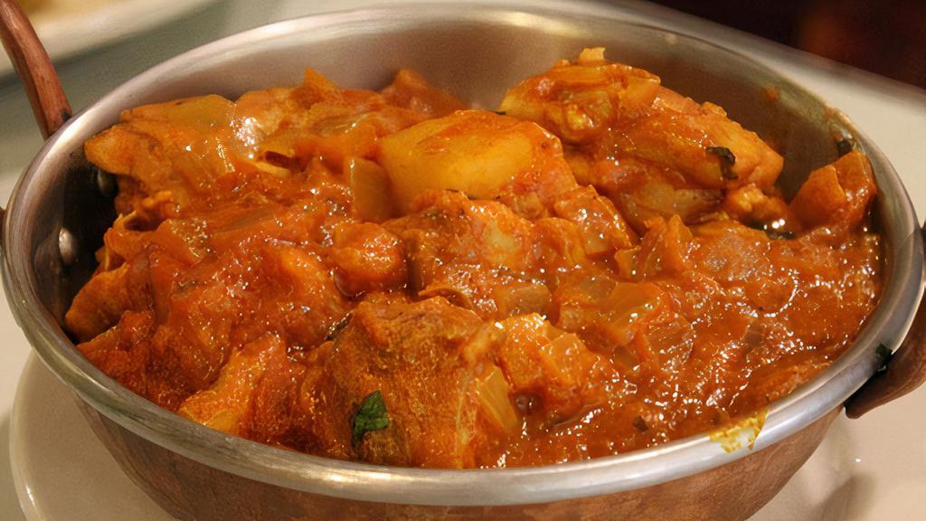 Chicken Vindaloo · Chicken curry with potatoes and herbs in a hot curry sauce.
