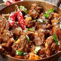 Karahi Gosht · Lamb cooked with butter, ginger, garlic, and spices in a semi-dry sauce.