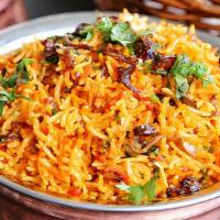 Vegetable Biryani · Mixed vegetables with basmati rice, onions, herbs, and spices.
