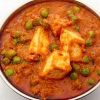 Mattar Paneer · Green peas and homemade cheese cubes with spices in a tomato cream sauce.
