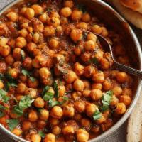 Chana Masala · Garbanzo beans with onions, fresh tomatoes, and spices North Indian style.