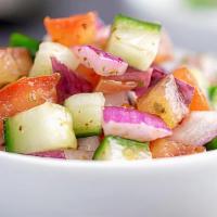 Kachumber · Fresh cucumbers, onions, and tomatoes with fresh herbs and lime juice.