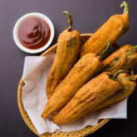 Stuffed Mirchi (5 pcs) · Fresh chili fried with chickpea flour and stuffed with onions and spices.