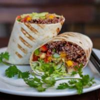 Vegetable Burrito · Flour tortilla stuffed with rice and Indian cottage cheese, onions, bell pepper, garbanzo be...