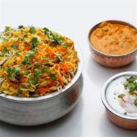 Hyderabadi Vegetable Dum Biryani · Fresh chicken marinated with herbs and spices, cooked on low-heat with basmati rice.