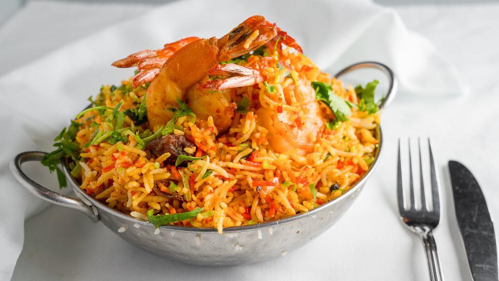 Shrimp Biryani · Shrimp cooked with basmati rice, with a mix of special herbs and spices. Served with raita.