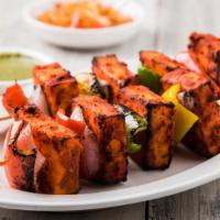 Tandoori Paneer Tikka · Homemade cheese marinated in yogurt with special herbs and spices.
