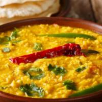 Yellow Dal · Yellow lentils cooked in herbs and spices.