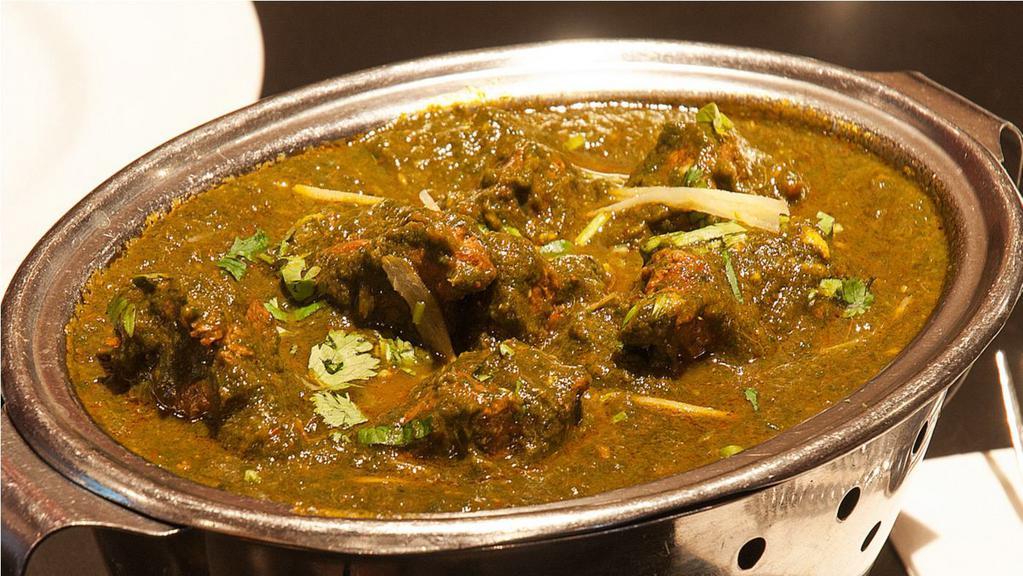 Gongura Goat · Goat meat with bone cooked with sour leaves, served as thick gravy
