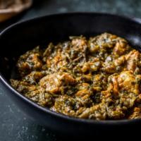 Lamb Saag · Boneless lamb cooked with spinach purée, herbs and spices.