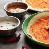 Mysore Masala Dosa · Thin crispy crepe spread with authentic mysore chutney and filled with potato curry.