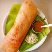 Kara Dosa · Puffy thin crispy crepe made with rice and lentil batter, spread with spicy chutney.