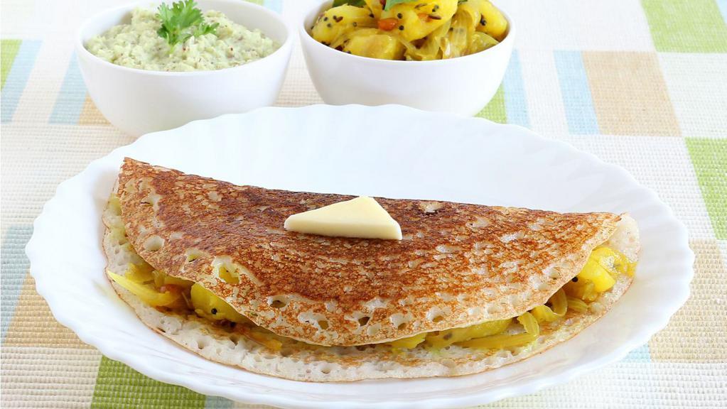 Onion Masala Dosa · Thin crispy crepe with an onion topping, filled with potato curry.