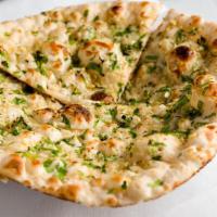 Garlic Cilantro Naan · naan with the flavor of garlic and cilantro – topped with melted butter