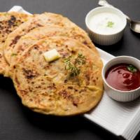 Aloo Paratha (2 pcs) · Whole wheat bread stuffed with potatoes and spices. Served with yogurt.
