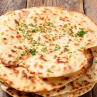 Butter Naan (2 pcs) · Naan finished with butter.