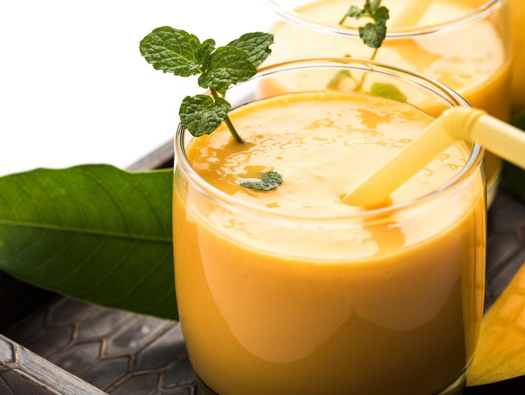 Mango Lassi · Homemade yogurt flavored with mango, a delightful drink.