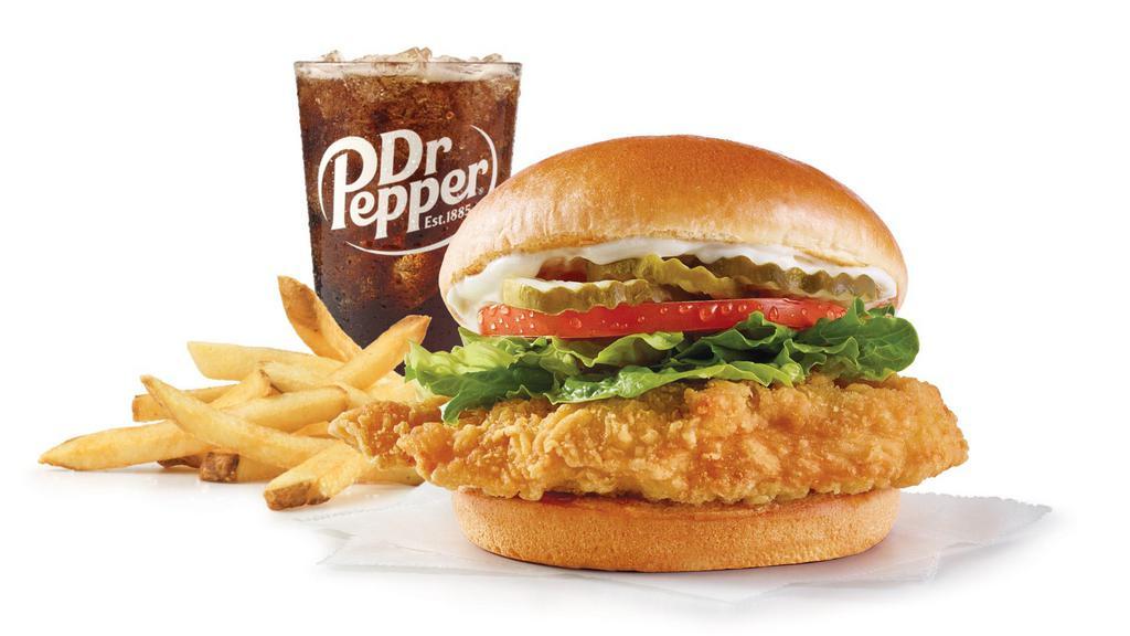 Classic Chicken Sandwich Combo · A juicy, lightly breaded crispy chicken breast with crunchy lettuce, tomato, mayo, and the perfect pickles, all on a toasted bun. It’s a flawless blend of nostalgia and excitement—kinda like your all-time favorite song, only better ‘cause you can eat it.