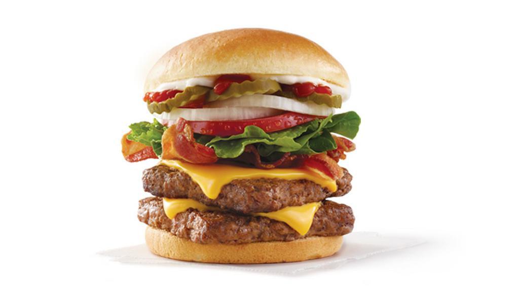 Big Bacon Classic® Double · A half-pound* of fresh, never-frozen beef, Applewood smoked bacon, American cheese, crisp lettuce, tomato, pickle, ketchup, mayo, mustard, and onion on a toasted bun. It’s big. It’s classic. It’s got bacon..
