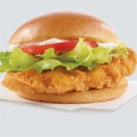 Classic Chicken Sandwich · A juicy, lightly breaded crispy chicken breast with crunchy lettuce, tomato, mayo, and the p...