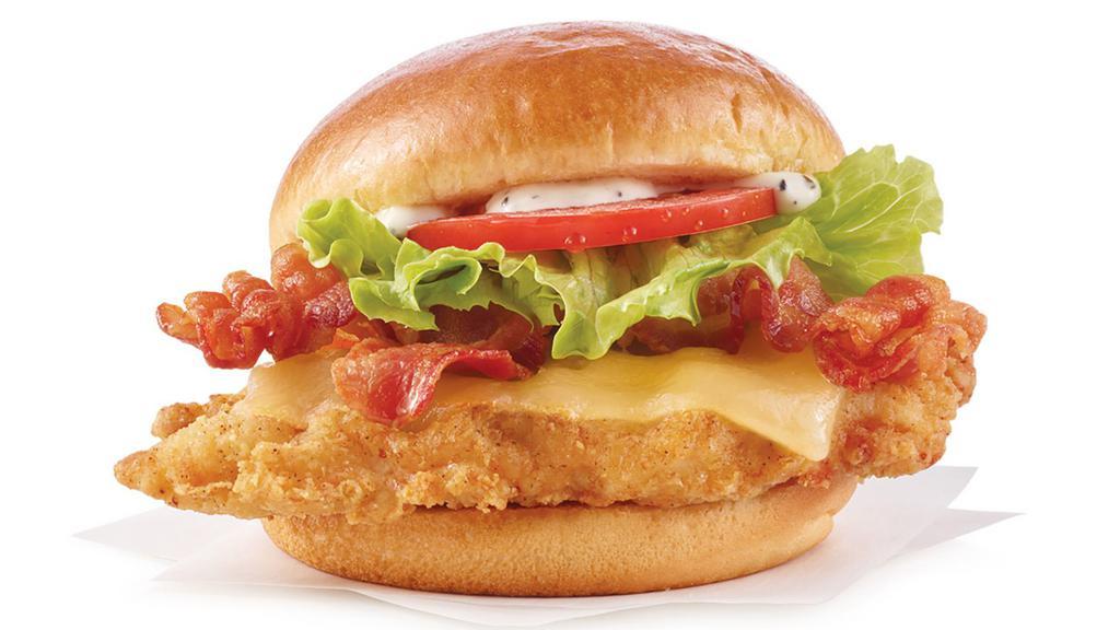 Asiago Ranch Classic Chicken Club · A juicy, lightly breaded chicken breast taken over the top with thick Applewood smoked bacon, Asiago cheese, creamy ranch sauce, crisp lettuce, and tomato, all on a toasted bun. A club favorite that’s anything but boring.