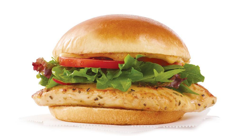 Grilled Chicken Sandwich · Try Wendy's fresh fast food Grilled Chicken Sandwich with chicken marinated in an herb blend, topped with tangy herb sauce, spring mix and tomato.