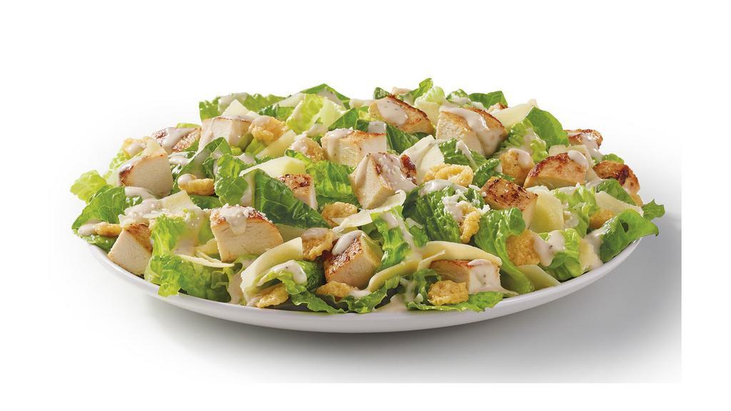 Parmesan Caesar Salad · Made fresh daily with romaine lettuce, grilled chicken breast, Italian cheeses, crunchy Parmesan crisps, and creamy Caesar dressing. One bite will tell you why it’s king of more than just the Romaines.