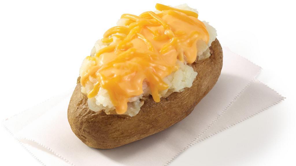 Cheese Baked Potato · Get yours oven-baked to perfection, topped with creamy cheese sauce and shredded cheddar. Cuz everything’s better with cheddar. Especially potatoes.