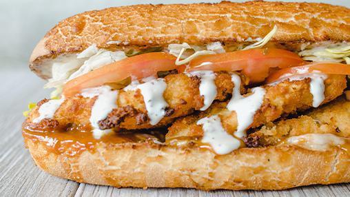 98. JAYMEE SIREWICH · Fried Chicken, Yellow BBQ Sauce, Ranch, Pepper Jack. All sandwiches are served hot with dirty sauce, lettuce, and tomato. [1660 cal]