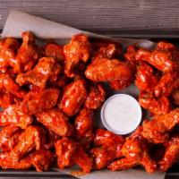 100 Wings · 100 antibiotic-free wings fried to a crisp, with your choice of 4 flavors.