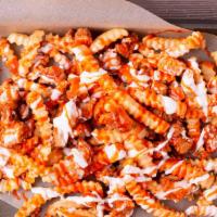 Buffalo Chicken Fries · Crispy Chicken served over a mound of french fries with buffalo and ranch drizzled on top