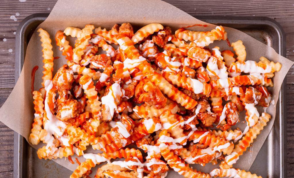 Buffalo Chicken Fries · Crispy Chicken served over a mound of french fries with buffalo and ranch drizzled on top
