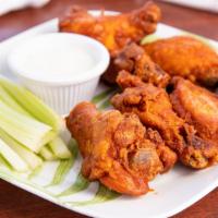 Pele's Spicy Buffalo Wings · Coated with our spicy Pele buffalo sauce.