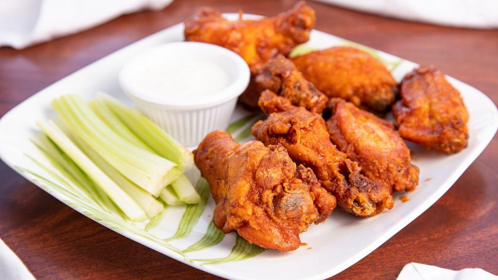 Pele's Spicy Buffalo Wings · Coated with our spicy Pele buffalo sauce.